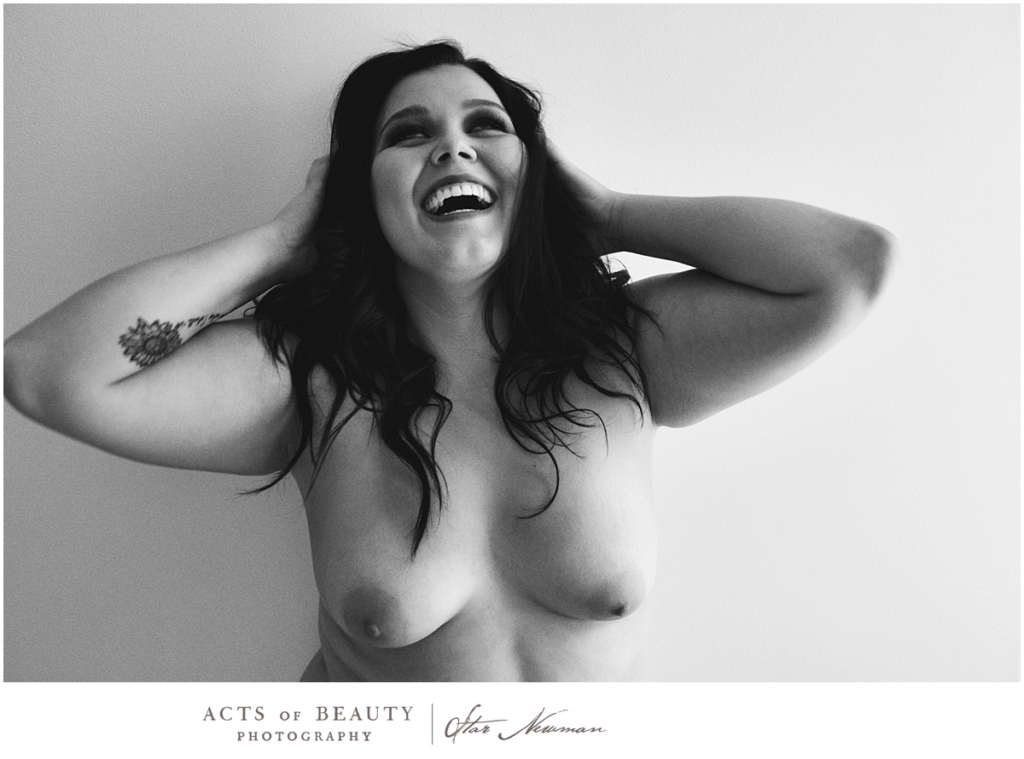 Laughing nude woman empowerment photo