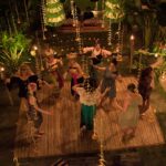 Women dancing with Balinese dancers at women's empowerment retreat