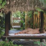 Beautiful nude boudoir photo of woman outdoors in Bali