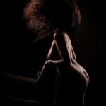 Beautiful boudoir photo of strong black woman with natural hair