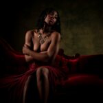 Stlyed photoshoot of black woman with gold makeup